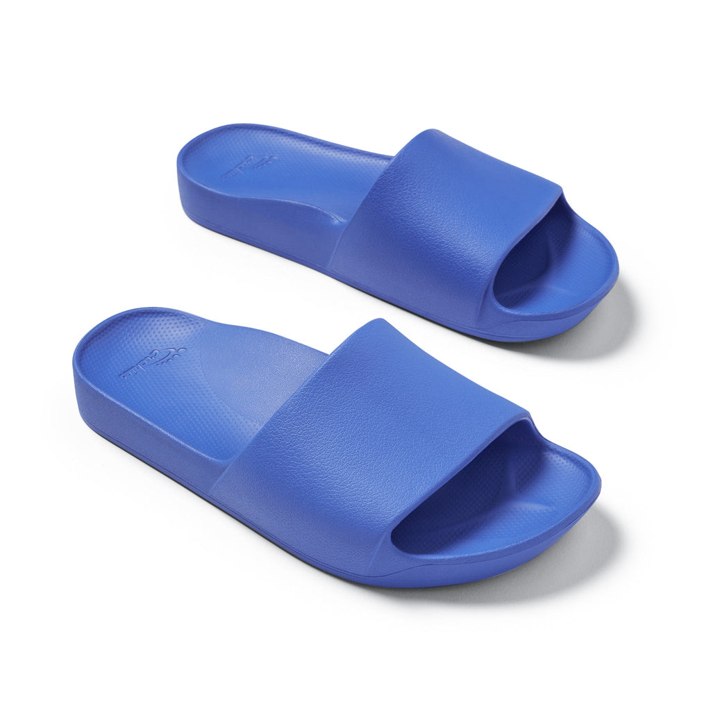 Royal Blue Arch support slides top down 3/4 angle studio image